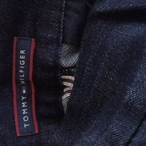 A Tommy Hilfiger skirt. It is denim and a size 4.